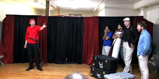 PHOTO: Hamlet (Alex Dabertin) gives the players (left to right: Arif Silverman, Andre Silva, James Overton, and Owen Moss Hayden) an acting lesson in Bad Quarto's 2016 production of 		
				<em>Hamlet: The First Quarto</em>, directed by Tony Tambasco. Photo by James M. Smith.