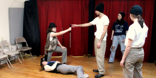 PHOTO: Nobs (Madeleine Morrell) hands Jack Straw (Andre Silva) the tax collector's sword to lead the rebellion in Bad Quarto's 2016 production of 		
				<em>The Life and Death of Jack Straw</em>, directed by Tony Tambasco. Photo by James M. Smith.